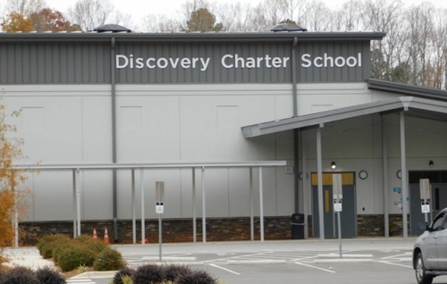 Weekend reads: The value of a degree, Chancellor eyes future, voter rolls look different and more a photo of a black and gray building with the words "Discovery Charter School" in white lettering