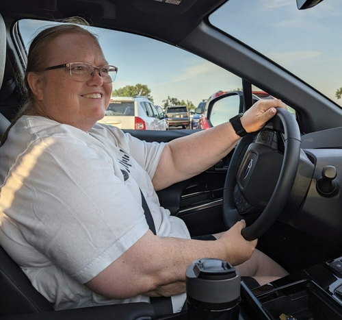 South Dakota-led poll finds alignment of rural, urban opinions on electric vehicles Shelly Stutson behind the wheel of her 2023 Subaru Soltera electric vehicle. (John Hult/South Dakota Searchlight)