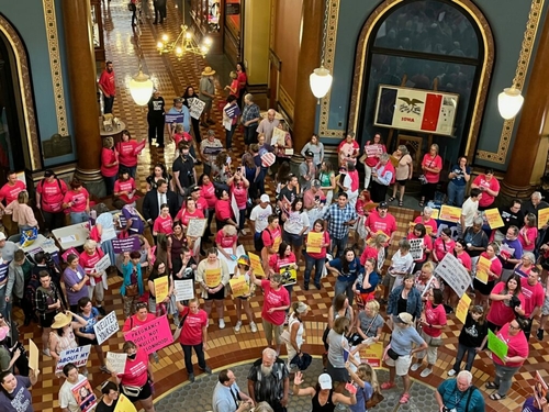 Iowa Legislature passes legislation to outlaw most abortions after six weeks A large number of protestors, holding pro and anti-abortion rights signs, in a large rotunda.