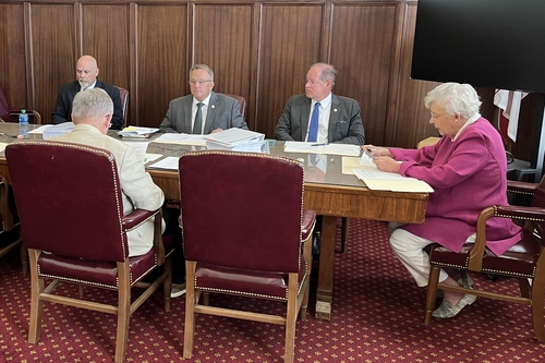 New Elmore County men’s prison will cost over $1 billion A meeting of people around a table