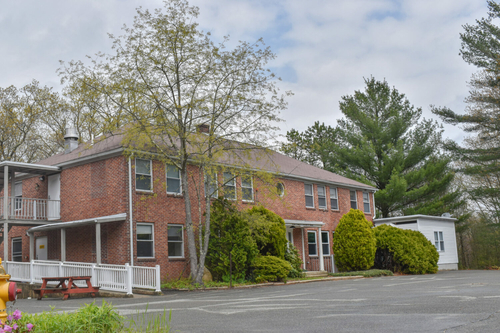 10 families can soon move into Zambarano ‘cottages’ in Burrillville One of the "cottages" the state hopes to repurpose into a temporary shelter for unhoused families. (Christopher Shea/Rhode Island Current)