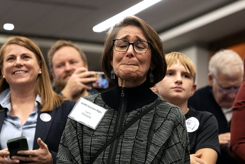 Abortion rights victories show issue is unlikely to fade in 2024 elections – 3 things to know A woman closes her eyes and appears to be crying, surrounded by other people.