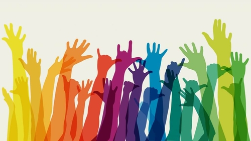 Could Milwaukee County become a sanctuary for LGBTQ people? Rainbow raised hands diversity LGBTQ school questions answers
