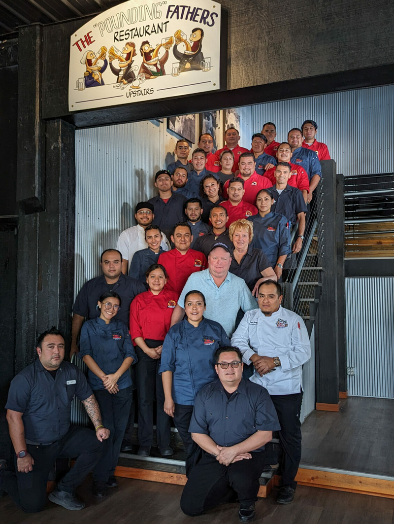 Volatile, costly international visa program strains SD’s tourism industry Janet Boyer and her son, Jonathon, owners of the Mt. Rushmore Brewing Company, pose with a group of 29 of their H2-B employees at the Mt. Rushmore Brewing Company/Pounding Fathers Restaurant in Custer. (Paul Horsted/for South Dakota Searchlight)