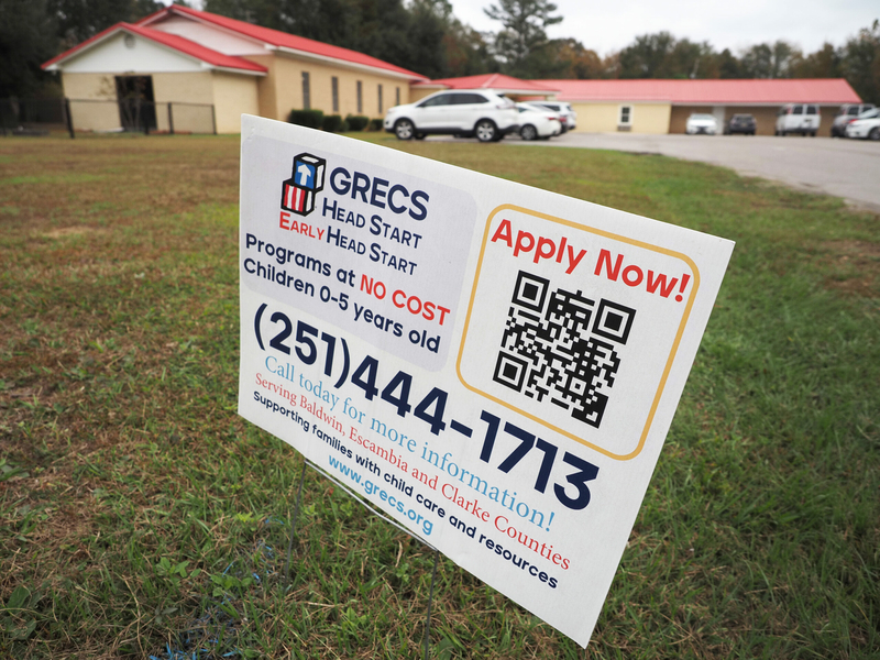 Fewer staff, fewer classrooms, lower pay: What losing ARPA money meant to an Alabama day care A sign encouraging people to apply to a Head Start program.