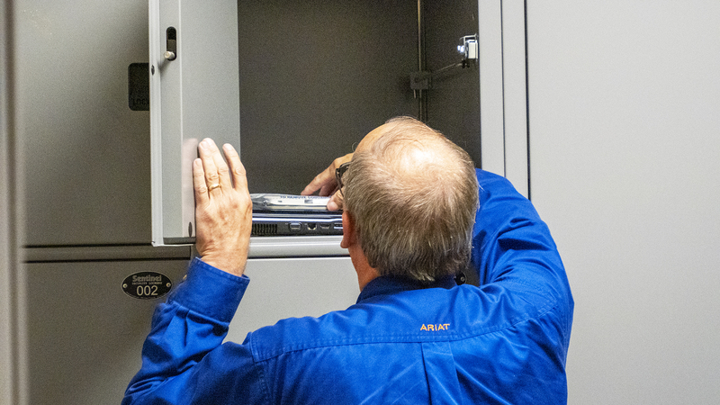Sheriff’s office agrees to destroy evidence obtained from raid on Kansas newspaper A Marion County undersheriff on Aug. 16, 2023, reaches into an evidence locker for items seized from the Marion County Record during an Aug. 11, 2023, raid by city police.