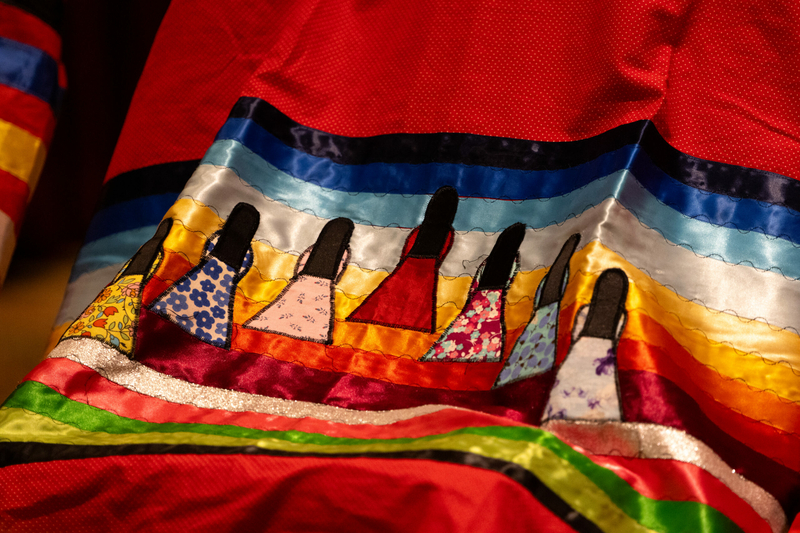Advocates call on the state to create a new MMIWR task force after shuttering the original A ribbon skirt displays female silhouettes over a colorful background.